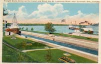 Freight boats going up the canal and down the St. Lawrence River postcard