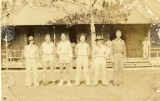 Six unidentified men, two in shorts photograph 1933
