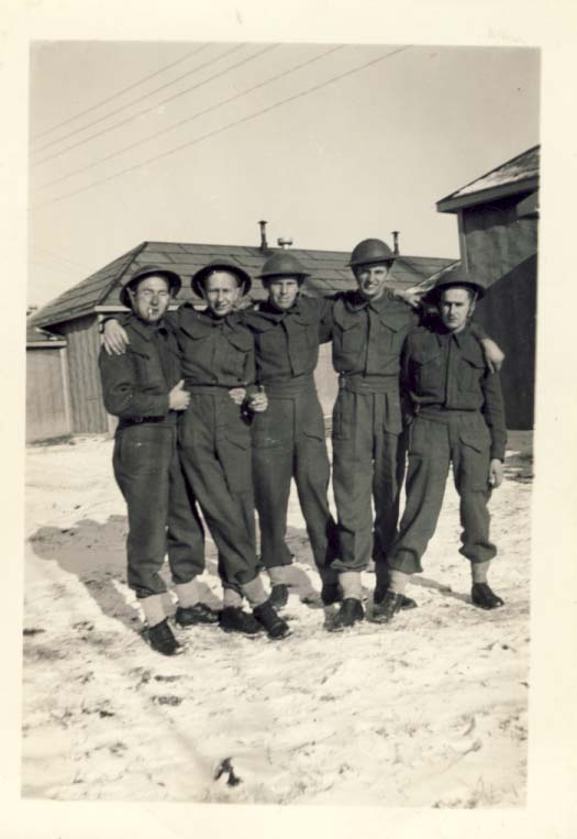Group of five military men standing in the snow photograph