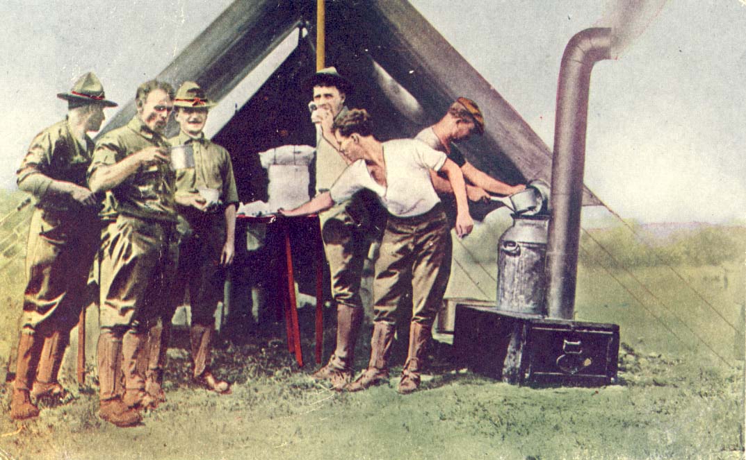 Six U.S. soldiers standing in front of a kitchen tent, with stove on right postcard
