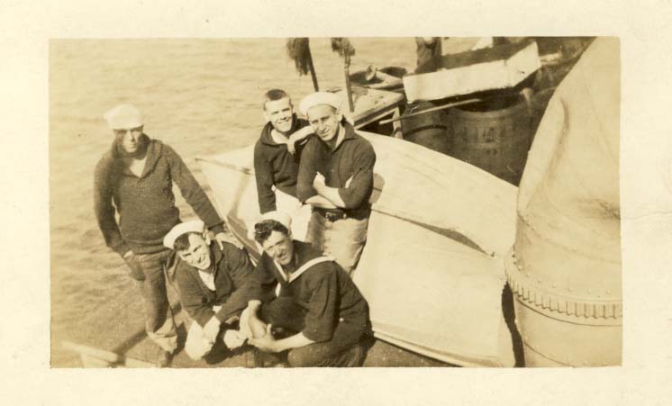 Five sailors on a dock postcard
